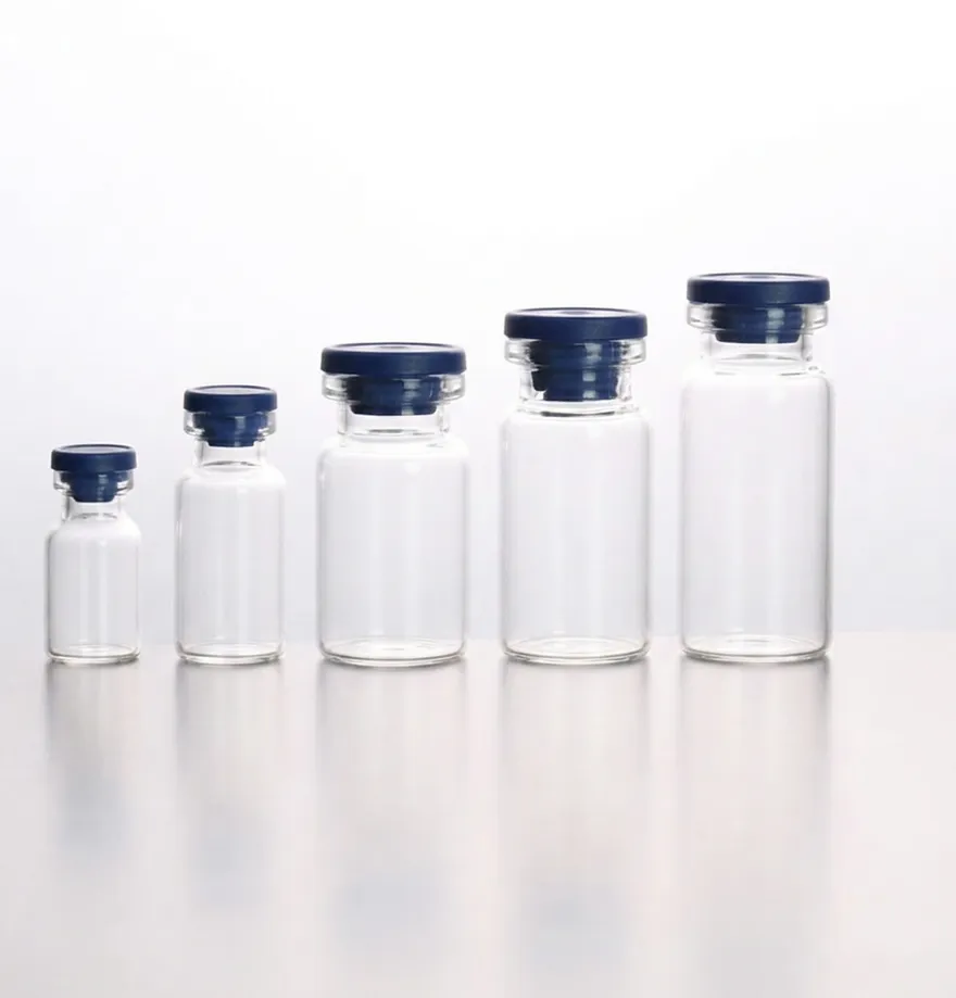 Five clear glass vials in ascending sizes, each sealed with a navy rubber stopper